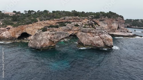 Calas de la isla de Mallorca en España, el mar azul en el mediterraneo, playas rocosas y acantilados que resaltan en el paisaje photo