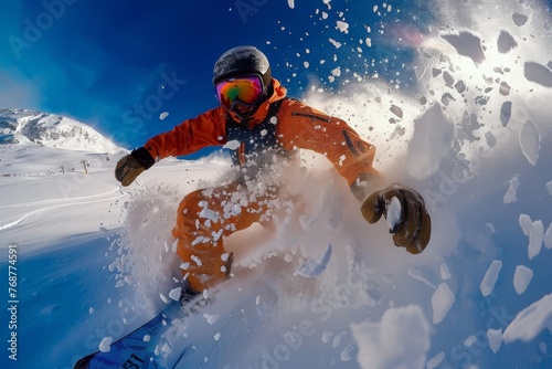 A man fearlessly rides a snowboard down a snow-covered slope, showcasing skill and adrenaline in a winter wonderland setting. photo