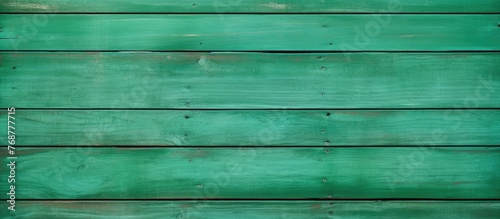 Weathered green wooden wall...