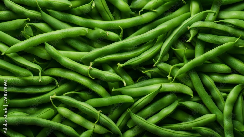 Green beans with water drops on a black background. Top view. Green beans with water drops on a black background. Top view.