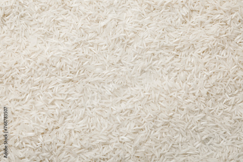 Raw basmati rice as background, top view