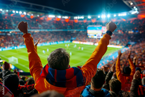 Backlit Football Fans: Vibrant Support at Dusk