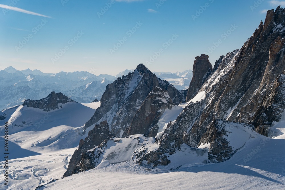 Aerial view of the beautiful snowy jagged Aiguille du Midi mountains in France