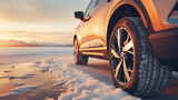 Sleek SUV on Icy Road at Sunset in Winter Landscape