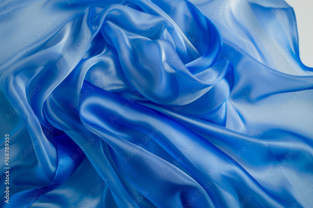 Smooth waves of blue satin fabric, capturing a sense of fluid elegance. Smooth waves of blue satin fabric, capturing a sense of fluid elegance.