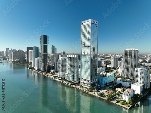 a city with tall buildings and green water in the middle  Miami Edgewater