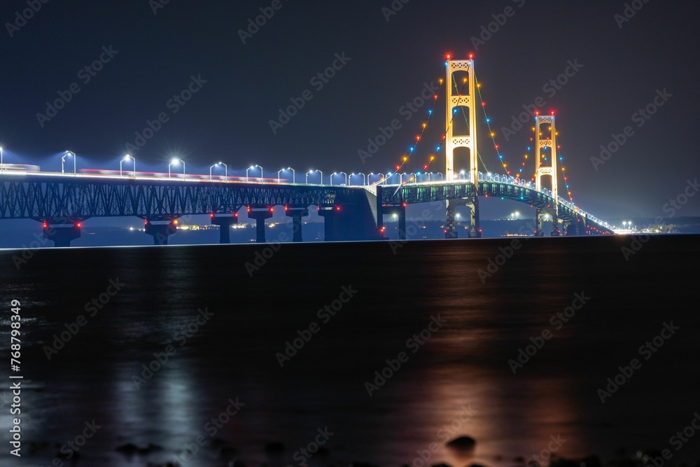 Aerial view of the Mackinac Bridge in Michigan illuminated by the lights at night