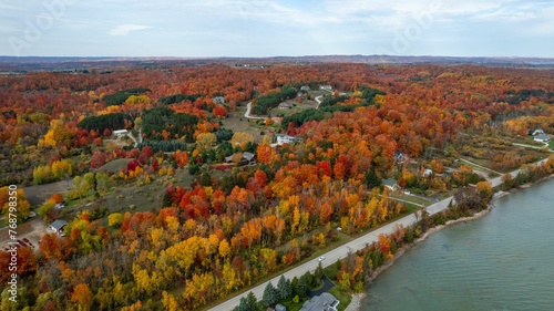 Aerial view of an autumnal scene of trees on the banks of a Cut River  in Michigan