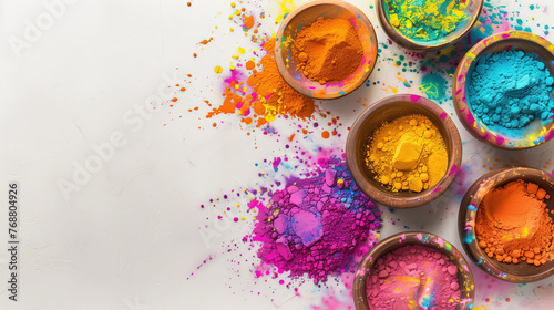 Holi color festival vibrant colours powder in bowls, top view