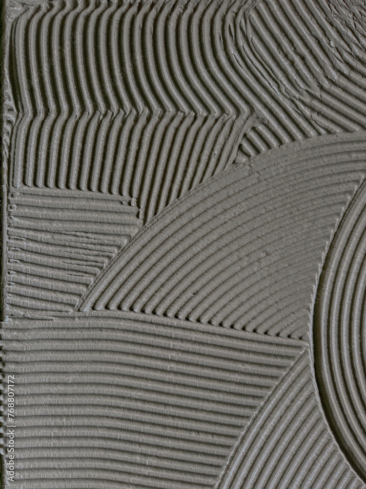 Fototapeta premium Texture cementitious adhesive applied to the floor ready to receive the ceramic tile.