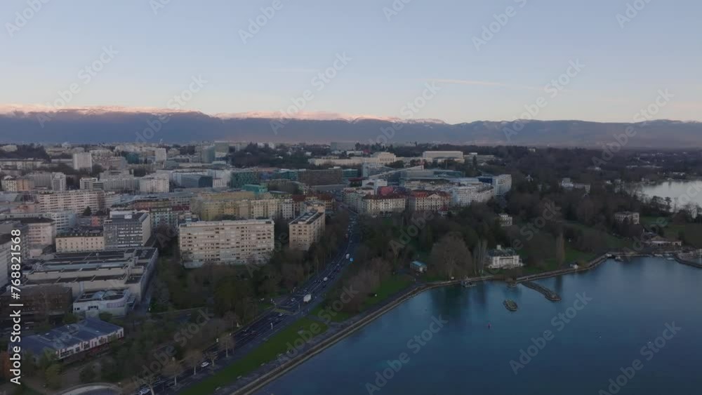 Aerial view of multistorey buildings in housing estate in urban borough at lake. Mountain ridge in background. Geneva, Switzerland Aerial view of multistorey buildings in housing estate in urban borough at lake. Mountain ridge in background. Geneva, Switzerland