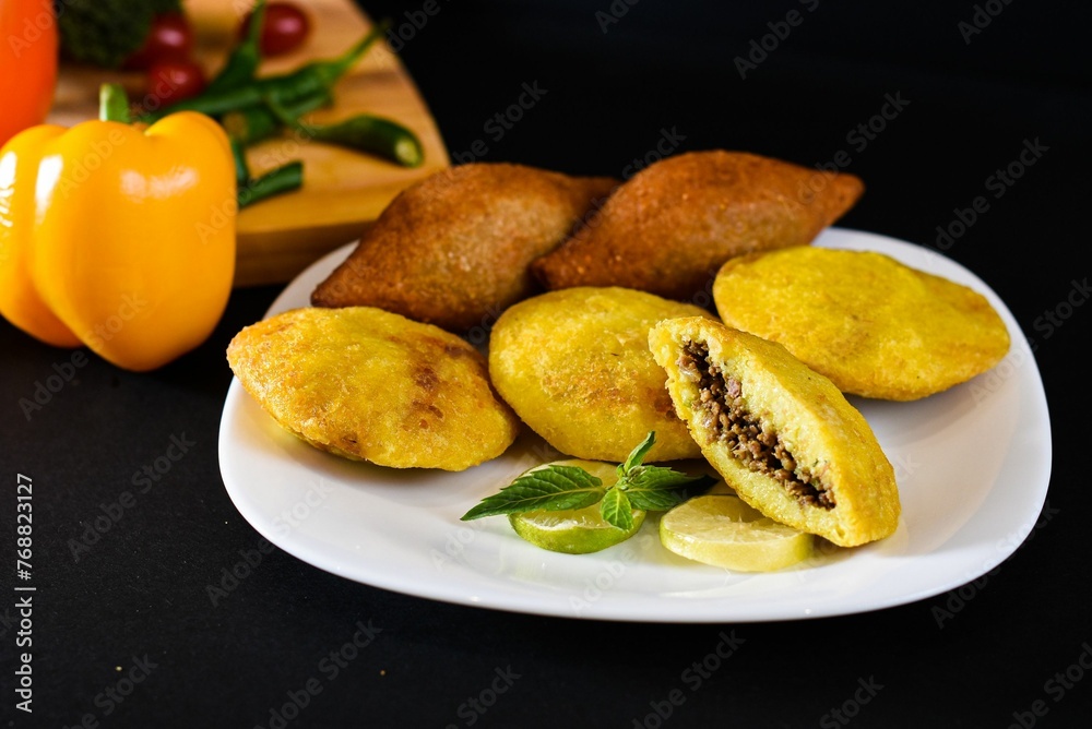 Kibbeh is a family of dishes based on spiced ground meat, onions, and grain, popular in Middle Easte Kibbeh is a family of dishes based on spiced ground meat, onions, and grain, popular in Middle Easte
