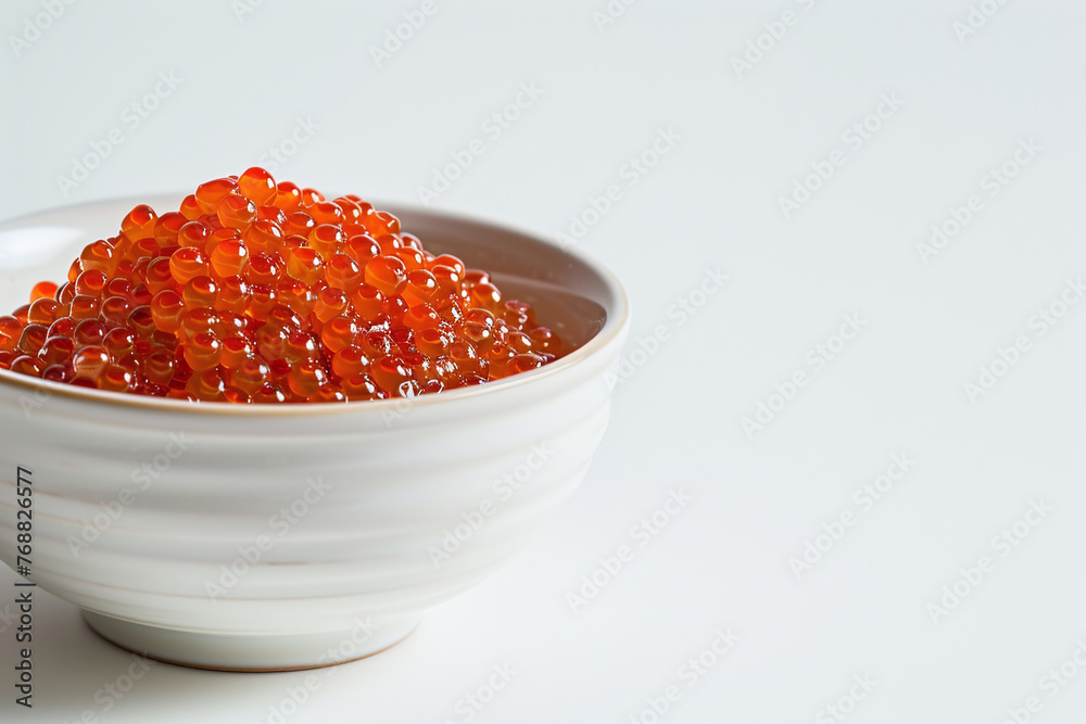 bowl of red caviar isolated on white backgrond, close up bowl of red caviar isolated on white backgrond, close up