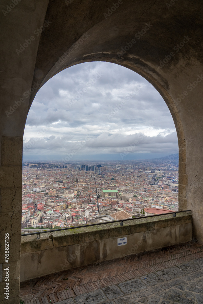 view of the cluster of buildings in Naples through the top of Castel Sant Elmo, Italy.