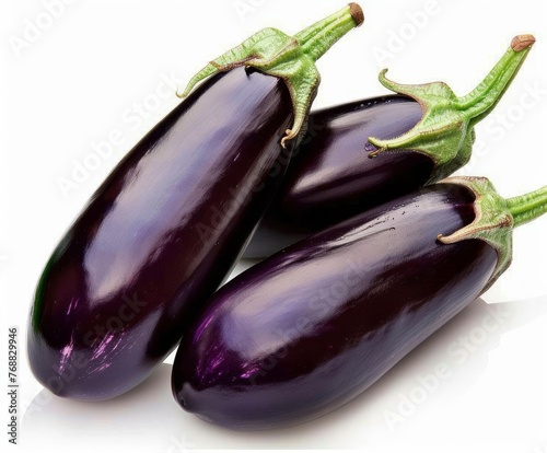 Three Eggplants With Leaves on a White Background