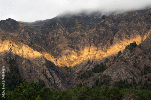 Mountain landscape with sunrise on Mount Gramos near the village of Plikati in northern Greece photo