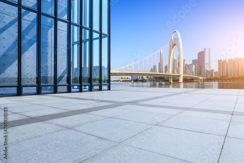 Empty square floor and glass wall with city buildings in Guangzhou © ABCDstock