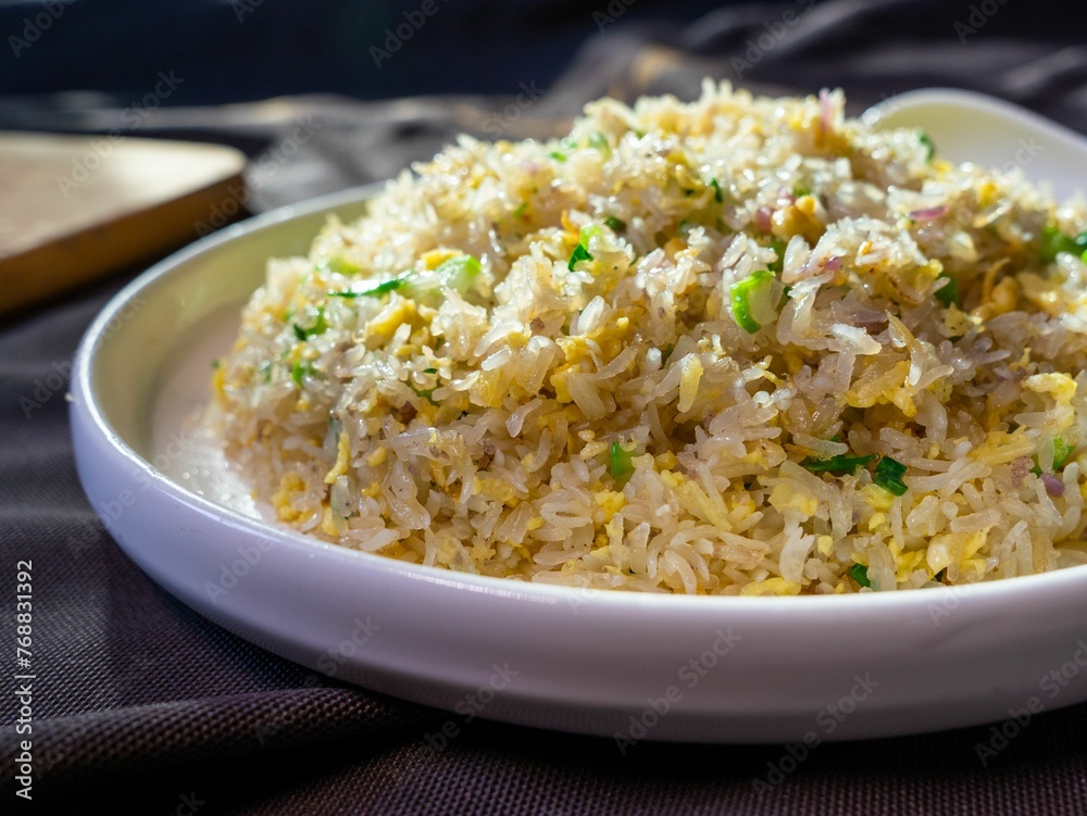 White plate with nutritious Yangzhou fried rice. White plate with nutritious Yangzhou fried rice.