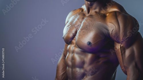 Afro American fitness model torso in purple top with well defined abdominal muscles