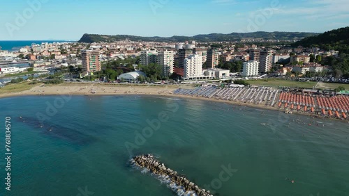 Drone shot of the buildings coastline of Pesaro and the sea in Italy