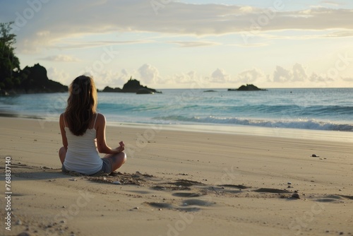 Calm woman meditating ocean sand beach