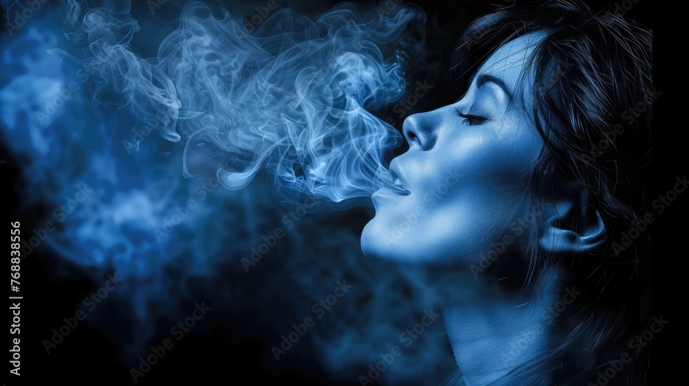 Woman exhaling blue smoke in a mystical manner
