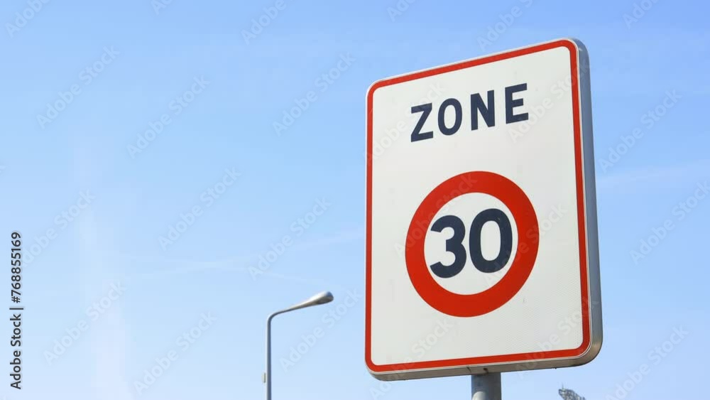 Zone 30 road sign, indicating the limit zone of thirty kilometers per hour for cars and other vehicles Zone 30 road sign, indicating the limit zone of thirty kilometers per hour for cars and other vehicles