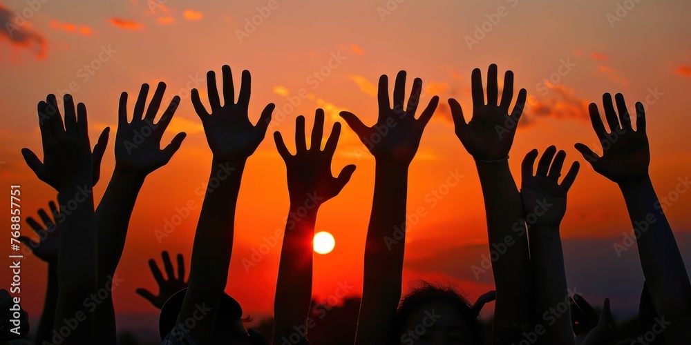 nspiration for Others: As the sun dips below the horizon and darkness descends, the silhouettes of many hands serve as a beacon of hope and inspiration for others