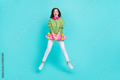 Full size photo of overjoyed cheerful person have fun enjoy free time isolated on turquoise color background