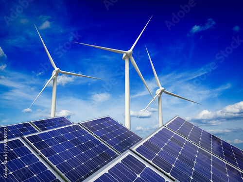 Green alternative energy and environment protection ecology concept - solar battery panels and wind generator turbines against blue sky © Dmitry Rukhlenko