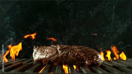 Tasty Beef Steak Placed on Grill Grid.