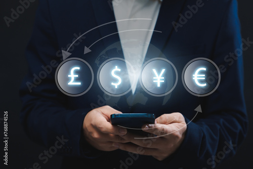 Currency exchange financial banking interbank foreign exchange and payment concept, with a businessman holding currency and with finger pointing at symbols in the copyspace.