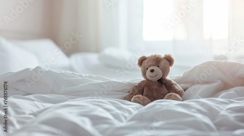 A cozy white bed with a single teddy bear, ready for a child's bedtime story