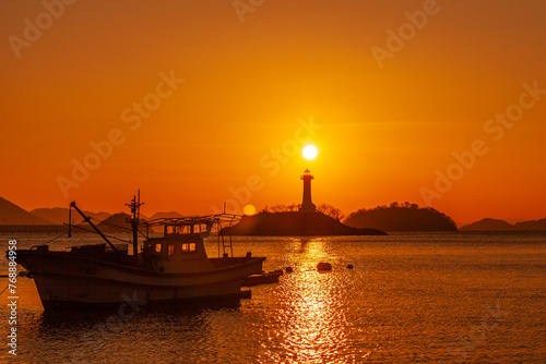 a sunrise view of the winter sea. A view of th port and lighthouse on a Winter morning from Sagungdumi port in Changwon, South Gyeongsang Province, South Korea.