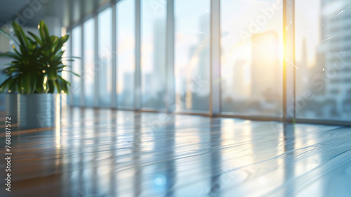 Blurred office interior background with panoramic windows and light from the window. Blurred office space with a business concept banner template 