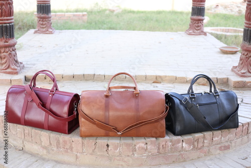 Leather Duffel travel bags made of crazy horse leather with shoulder straps for luggage and clothing photo