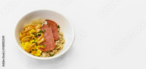 Filipino breakfast bowl with carmalized fired spam, topped with spice dijon mustard, rice and egg