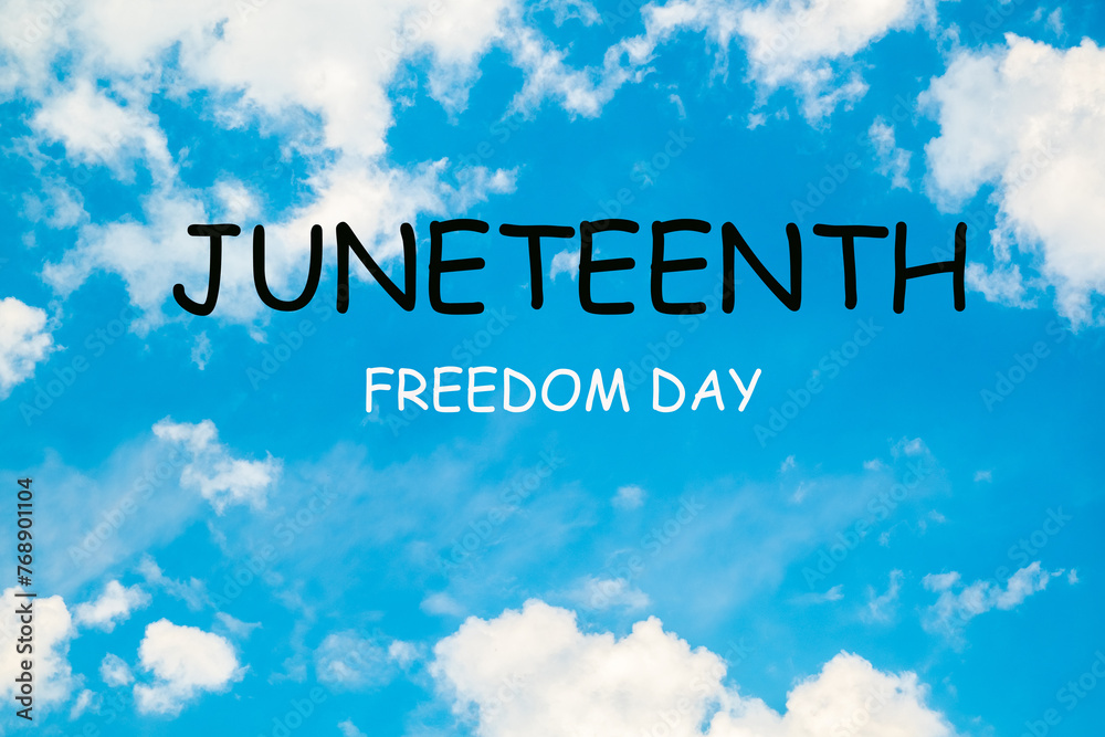 Juneteenth freedom day - text on a blue sky background. Juneteenth freedom day - text on a blue sky background.