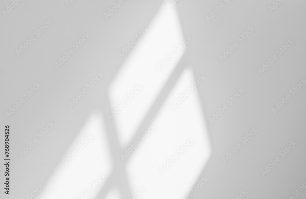 Abstract light reflection and grey shadow from window on white wall background, dark gray shadows and sunshine overlay effect for backdrop and mockup design Abstract light reflection and grey shadow from window on white wall background, dark gray shadows and sunshine overlay effect for backdrop and mockup design