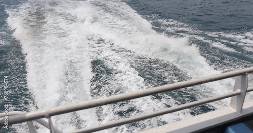 Ship wake up in the ocean. aves from the back of a speed boat over the water's surface in the sea. Waves behind a boat on a clear blue sea