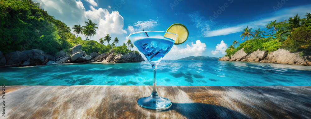 A cocktail on a beach bar counter with a clear blue ocean and sky in ...