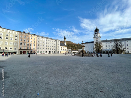 Salzburg, Austria - Nov 1 2023 : View of Mozartplatz in Salzburg, Austria, featuring the iconic statue of Mozart, historic buildings, and vibrant atmosphere of this famous square. photo