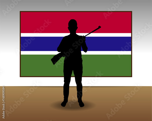 Man holding a gun in front of Gambia flag, fight or war idea