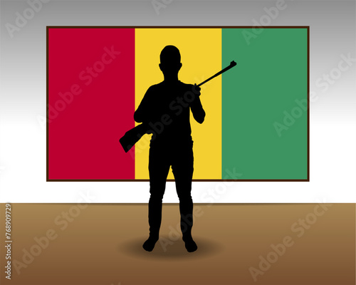 Man holding a gun in front of Guinea flag, fight or war idea