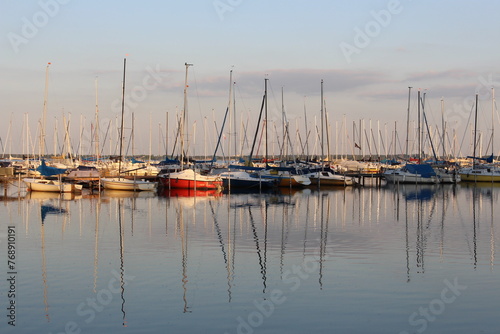 Evening Serenity: Sailboats Moored at Steinhudermeer © Nieschefart