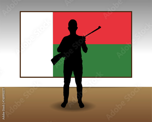 Man holding a gun in front of Madagascar flag, fight or war idea