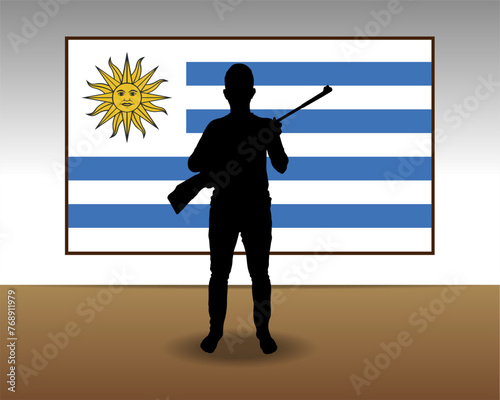 Man holding a gun in front of Uruguay flag, fight or war idea