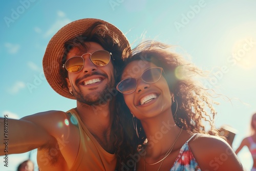 Multicultural couple smiling at the beach photo