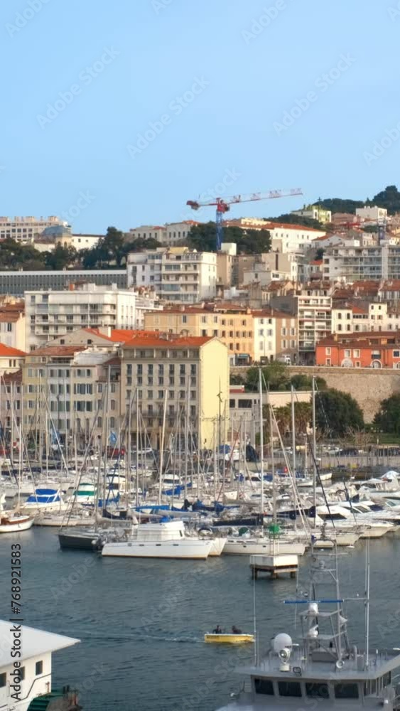 Marseille Old Port (Vieux-Port de Marseille) with yachts and Basilica of Notre-Dame de la Garde. Marseille, France. Camera pan Marseille Old Port (Vieux-Port de Marseille) with yachts and Basilica of Notre-Dame de la Garde. Marseille, France. Camera pan