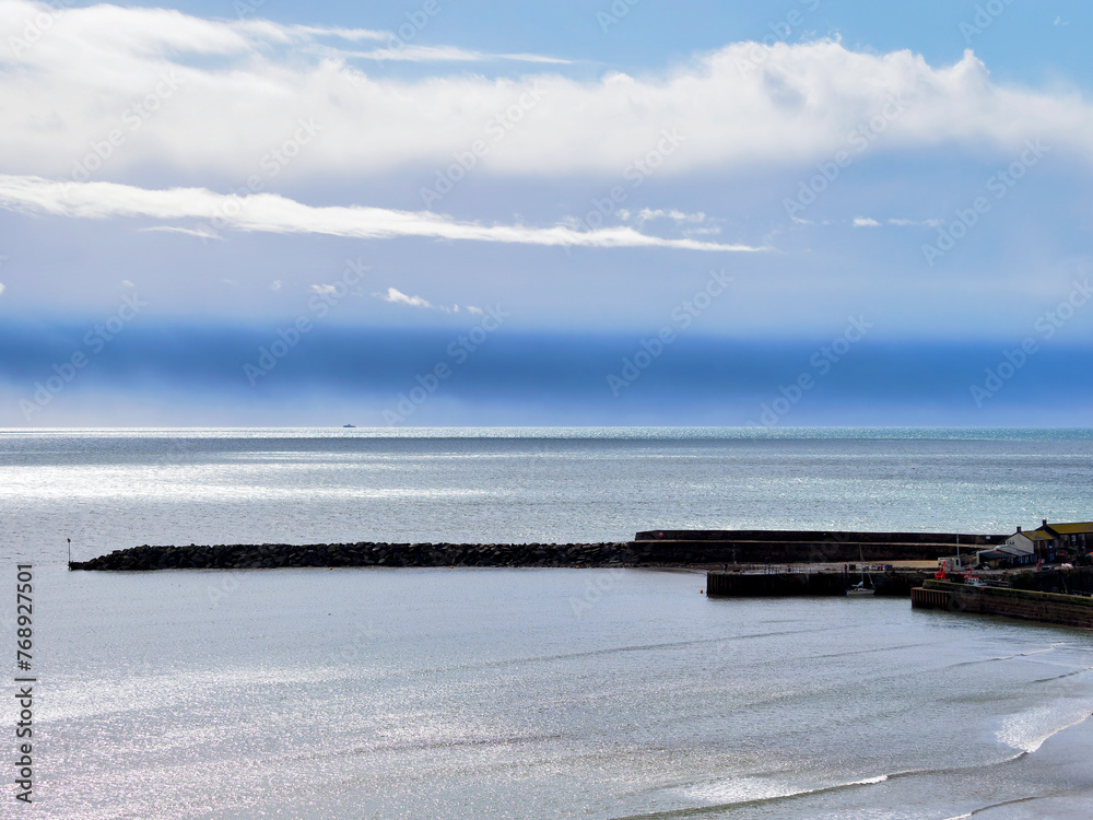 Scenic view of Lyme Bay at Lyme Regis in Dorset under the spring squally weather in March
